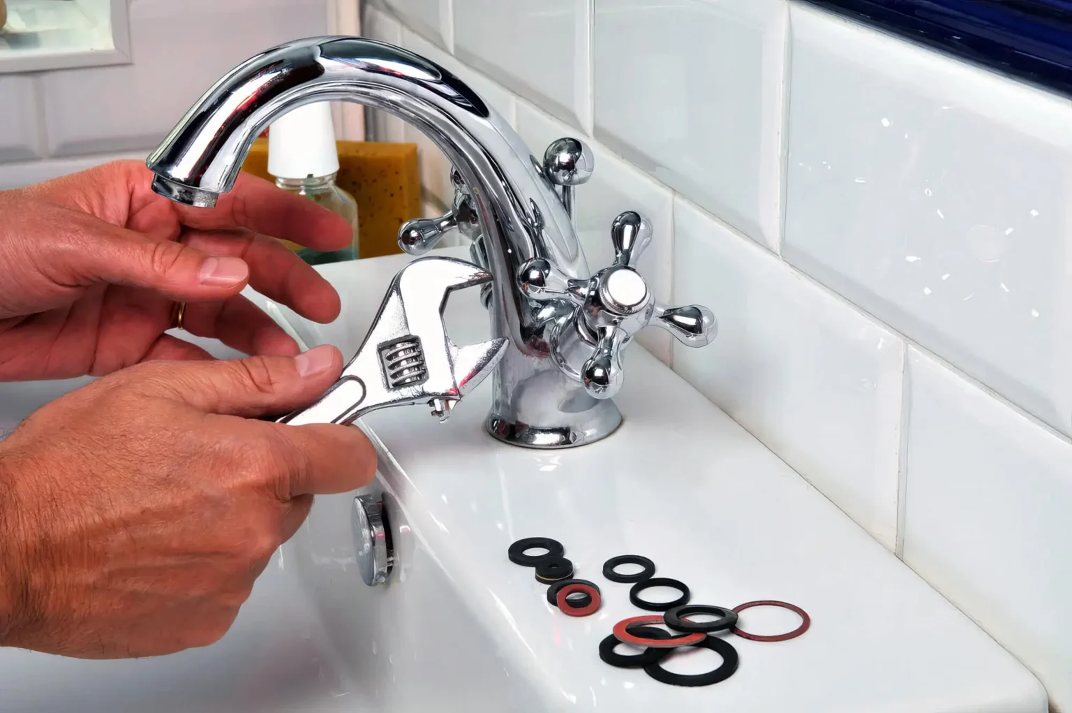 Plumber maintaining a bathroom faucet in Manteca
