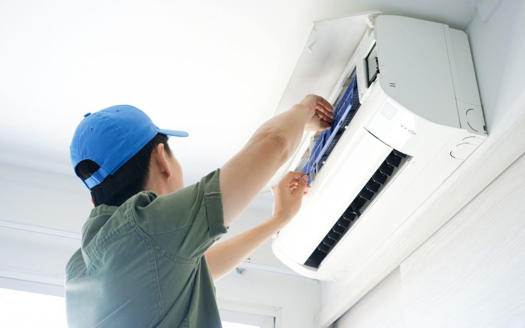 HVAC technician servicing a ductless mini split in Manteca