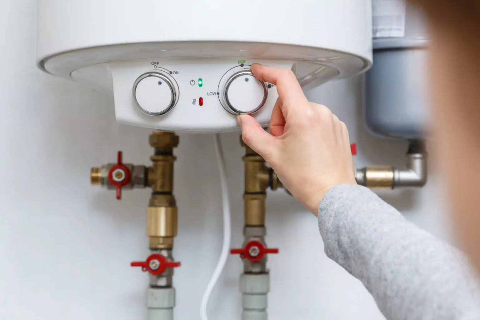 Technician adjusting a water heater in Manteca